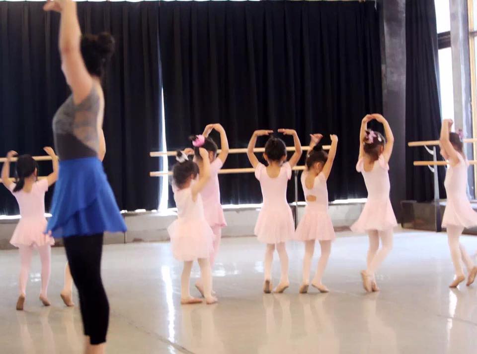 Juilliard trained ballet teacher twirling with kids